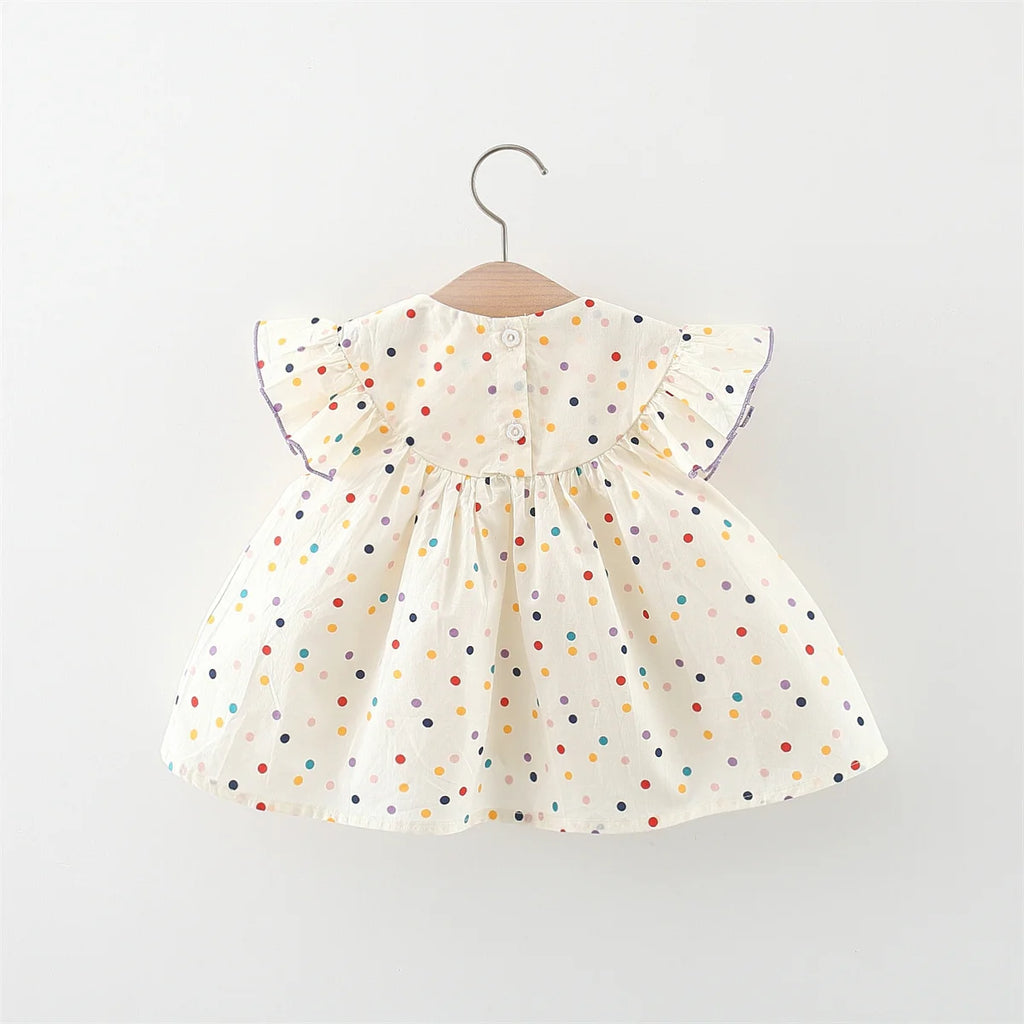 Robe pour petite fille à poids et à fleurs : fraîcheur et tendresse en petites touches colorées !