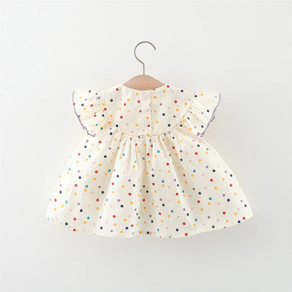 Vestido de niña con lunares y flores: ¡frescura y ternura en pequeños toques de color!