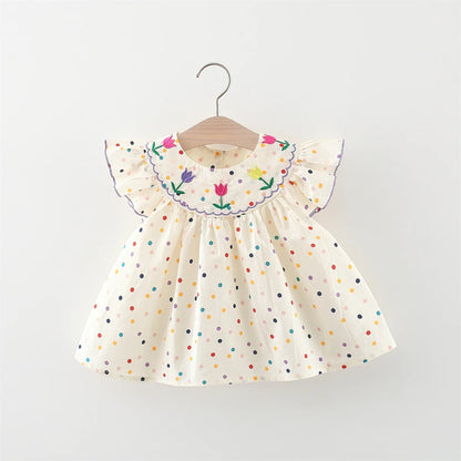 Vestido de niña con lunares y flores: ¡frescura y ternura en pequeños toques de color!