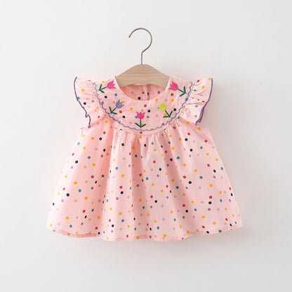 Vestido de niña con lunares y flores: ¡frescura y ternura en pequeños toques de color!
